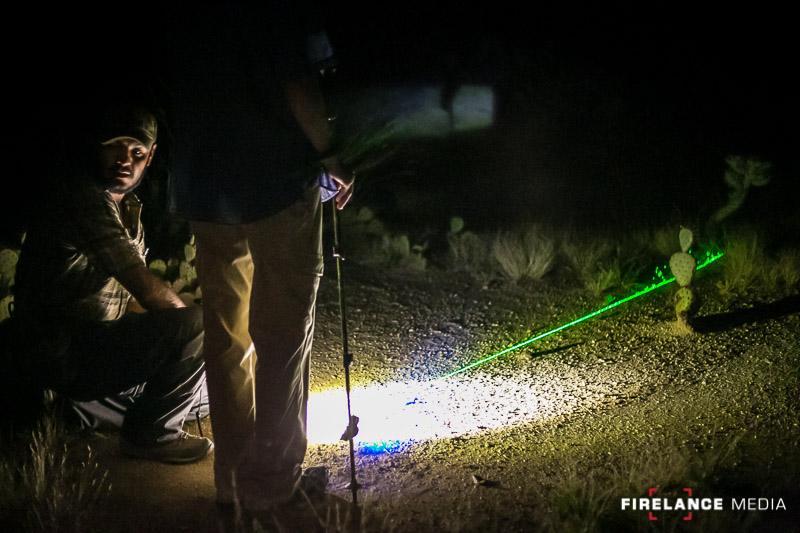 Freddy Osuna demonstrating the use of a green laser to determine track locations at night
